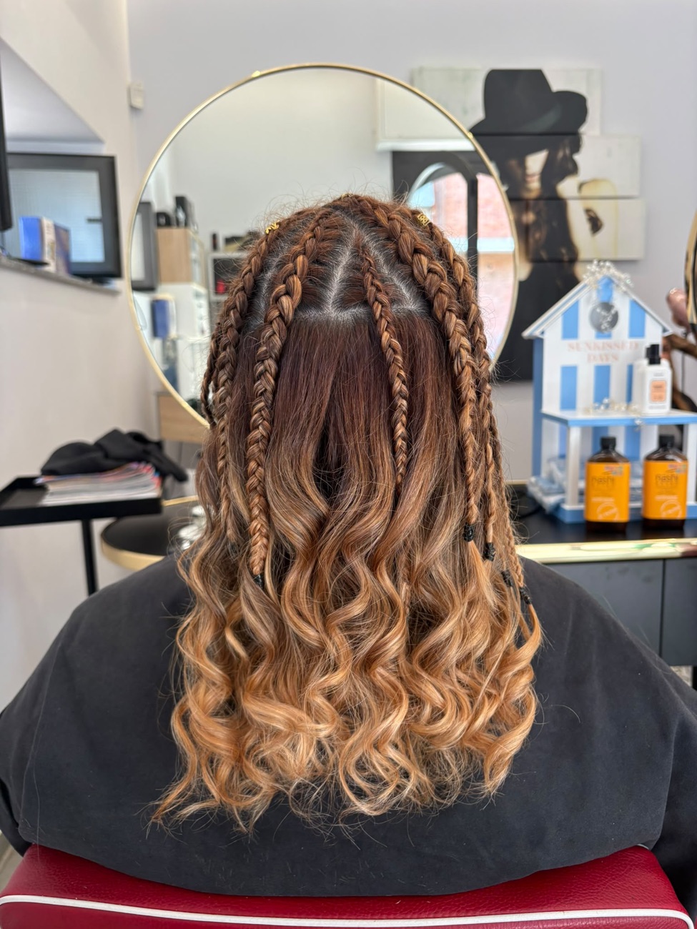 Semiraccolto con treccine boxer braids e onde - acconciatura Nuova Immagine Brugherio